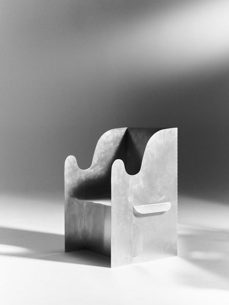 Katy Brett's 'UnEarthed' folded aluminium chair (via The Radford Gallery) 
